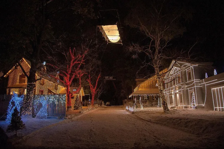 American suburban street backlot near Sofia dressed with Christmas lights and snow at night