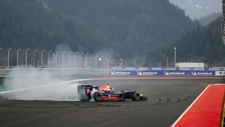 Race car under smoke on the A1 Motor Park circuit near Samokov, Bulgaria