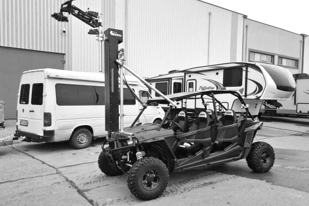 Camera crane rigged to an off-road buggy at a production base in Bulgaria