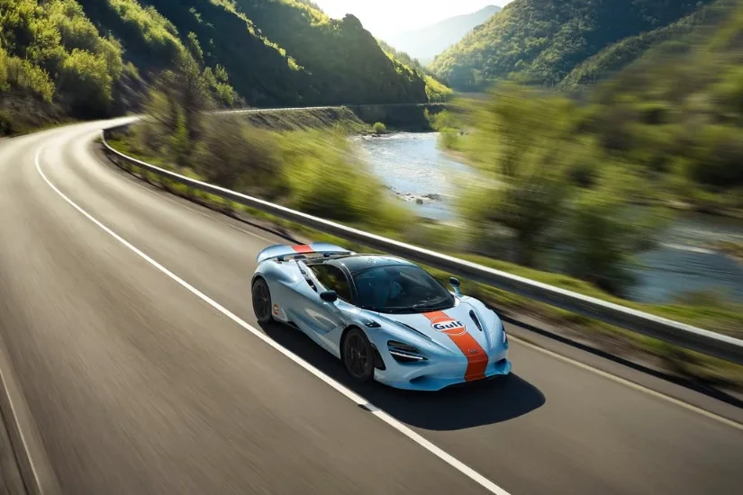 McLaren 750S in Gulf livery on a gorge road beside a river in southwest Bulgaria